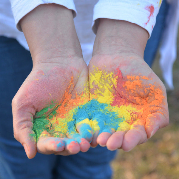 Holi colored powder in hands
